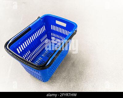 empty shopping basket on floor Stock Photo