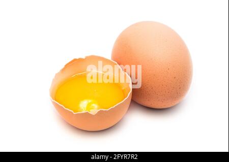 whole and broken hen eggs isolated Stock Photo