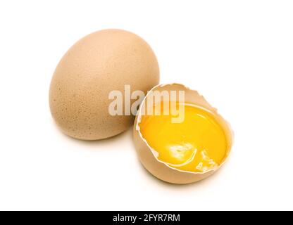 whole and broken hen eggs isolated Stock Photo