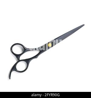 professional hairdresser black scissors isolated on white. Black barber scissors, close up. Stock Photo