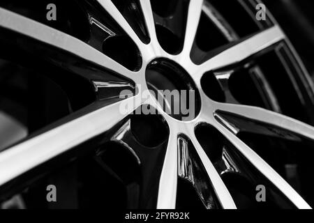 Black alloy wheels for premium cars, close-up. Purchase and replacement of autodisks. Stock Photo