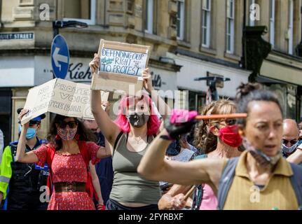 Bath, Somerset, UK. 29th May, 2021. Kill the bill protesters carrying anti government placards and signs are pictured as they take part in a kill the bill protest march through the centre of Bath. The protesters took to the streets to demonstrate about the police, crime, sentencing and courts bill which the UK government wants to bring into force.The bill includes major government proposals on crime and justice in England and Wales. Credit: Lynchpics/Alamy Live News