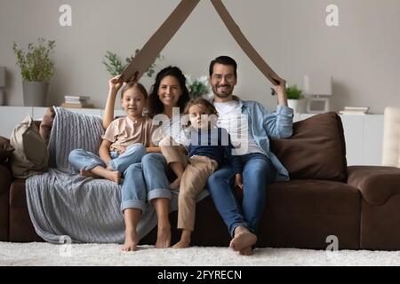 Portrait of happy family with kids in new home Stock Photo