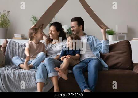 Overjoyed family with kids happy to relocate Stock Photo