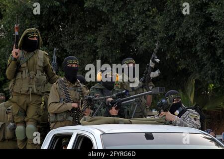 Gaza. 29th May, 2021. Members of Saraya al-Quds brigades, the military wing of the Palestinian Islamic Jihad movement, take part in a military parade in Gaza City, on May 29, 2021. Credit: Rizek Abdeljawad/Xinhua/Alamy Live News Stock Photo