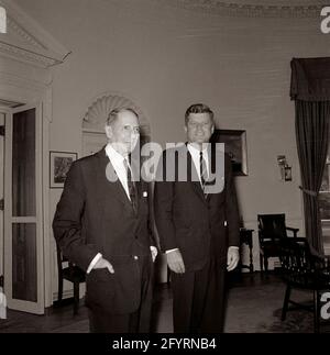 16 August 1962 President John F. Kennedy meeting with General Douglas MacArthur, 10:50AM, in the Oval Office of the White House. Stock Photo