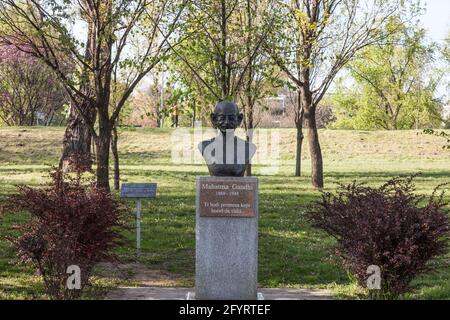 BELGRADE, SERBIA - APRIL 24, 2021: Bronze bust statue of Mahatma Gandhi in a park of New Belgrade. Gandhi is an Indian incon, symbol of non violent st Stock Photo