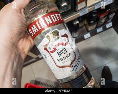 Picture of the logo of Smirnoff on some bottles for sale in Belgrade. Smirnoff is a brand of vodka owned and produced by the British company Diageo. T Stock Photo