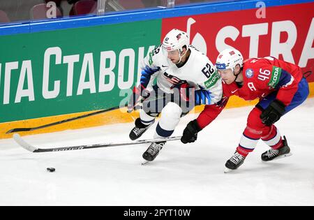 Riga, Latvia. 29th May, 2021. The United States forward Kevin Labanc (L) vies with Norway's forward Mathis Olimb during the Group B match at the 2021 IIHF Ice Hockey World Championship in Riga, Latvia, May 29, 2021. Credit: Edijs Palens/Xinhua/Alamy Live News Stock Photo