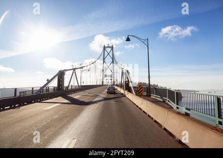 Drive across the famous Lions Gate Bridge in the modern Downtown City. Stock Photo