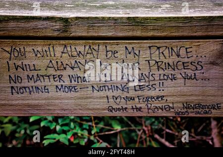A love letter is scrawled on the wooden railing at Magnolia Landing, May 27, 2021, in Magnolia Springs, Alabama. Stock Photo