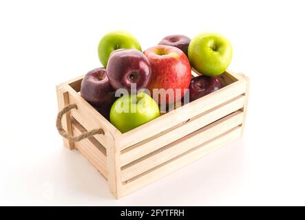 green and red apples in wooden box Stock Photo