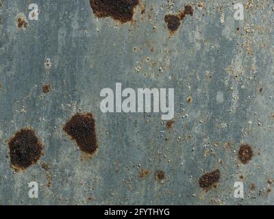 Galvanized steel surface with rust spots using as background Stock Photo