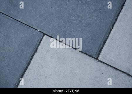 A high angle shot of two different colors of tiles on a surface Stock Photo