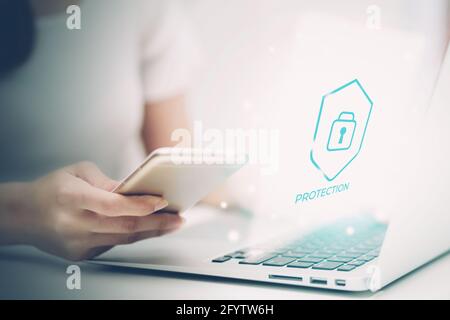 Digital network and cyber security for safe and privacy about data, businesswoman using laptop computer while display futuristic virtual lock login fo Stock Photo