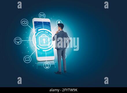 Businessman standing while cyber security with smart phone, access data and privacy with protection digital with smartphone, innovation of system prot Stock Photo