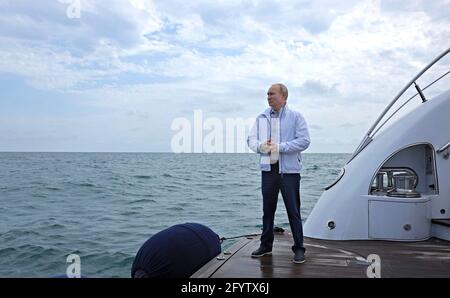 Sochi, Russia. 29th May, 2021. Russian President Vladimir Putin waits on the deck of a yacht to welcome Belarus President Alexander Lukashenko on the Black Sea May 29, 2021 in Sochi, Russia. Credit: Planetpix/Alamy Live News Stock Photo