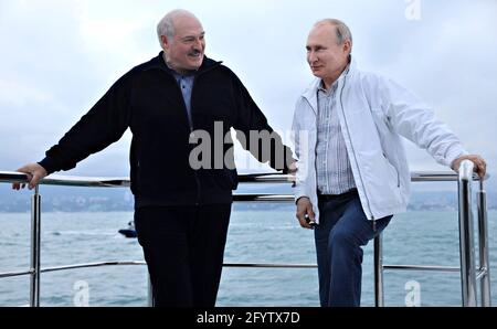 Sochi, Russia. 29th May, 2021. Russian President Vladimir Putin chats with Belarus President Alexander Lukashenko, left, during a yacht trip on the Black Sea May 29, 2021 in Sochi, Russia. Credit: Planetpix/Alamy Live News Stock Photo