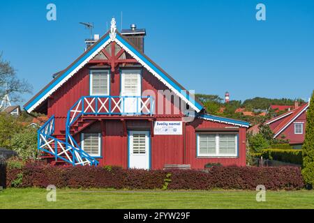 Beautiful old Lithuanian traditional wooden houses of the Curonian Spit in Nida fishermen's village, Lithuania, Europe Stock Photo