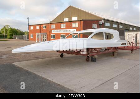 A fibre glass top section to a large motor boat sitting on a metal platform Stock Photo