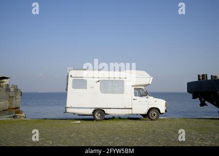 Vintage camper van parked by the riverfront Stock Photo - Alamy