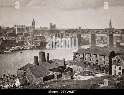 A late 19th century view of the High Level Bridge, a road and railway bridge spanning the River Tyne between Newcastle upon Tyne and Gateshead in North East England. It was designed by Robert Stephenson to form a rail link towards Scotland for the developing English railway network and officially opened by Queen Victoria in 1849. The castle and cathdral can be seen on the skyline. Stock Photo