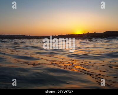 Sunset over Adriatic Sea viewed from water level, Cavallino, Veneto, Italy Stock Photo