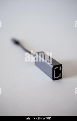 Ethernet laptop adapter - type C on a white background. Stock Photo