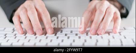 Business female typing on keyboard computer. Stock Photo
