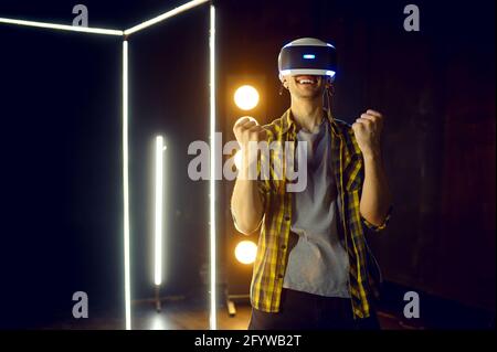 Happy man using virtual reality headset Stock Photo