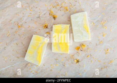Soap. Many various white homemade bar soaps, spa bath products for skincare. Flat lay hygiene toiletries on marble table. Natural olive soap bars Stock Photo