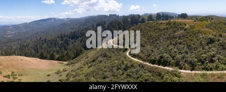 Scenic trails meander through the vegetation-covered hills of the East Bay, just a few miles from San Francisco Bay in Northern California. Stock Photo