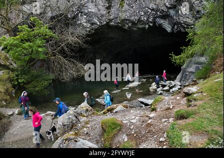 Rydal Cave, above Rydal Water lake in the Lake District National Park. The cave is the result of past slate mining and is now a visitor attraction. Stock Photo