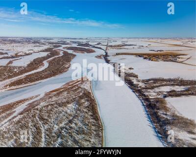 Aerial view of the North Saskatchewan River in a rural area of the prairies during the winter. Stock Photo