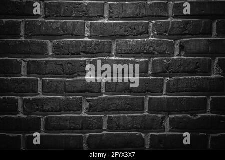 Black or dark gray sanded old loft brick wall texture background Stock Photo