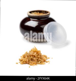 Heap of Chinese fermented cabbage, tung choi,  and ceramic bowl in the background isolated on white background Stock Photo