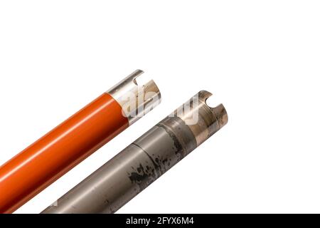 worn and new heating top shafts, toner fixing rollers, laser printer parts Stock Photo