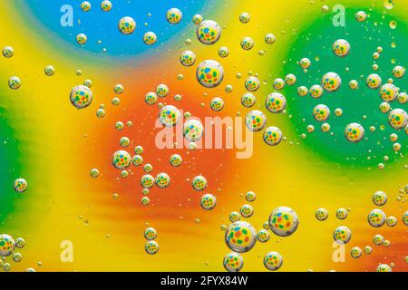 Abstract multicolor background with circles, transparent bubbles, liquid art. Rainbow abstraction, drops pattern, creative geometric design, bright fu Stock Photo