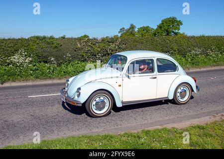 1990 90sVw Volkswagen Type 1 old type super Beetle, Vehicular traffic, moving vehicles, Vee Dub cars, vehicle driving on UK roads, german motors, motoring en-route to Capesthorne Hall classic May car show, Cheshire, UK Stock Photo