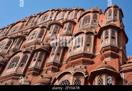 The beautifully ornate red and pink sandstone façade of Hawa Mahal, aka 'Palace of Winds', Royal City Palace, Jaipur, Western India, Asia.