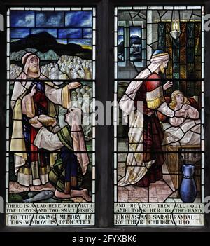 Stained glass window by Percy Bacon & Brothers depicting Christ healing and feeding the 5000, Lady St Mary  Church, Wareham, Dorset Stock Photo