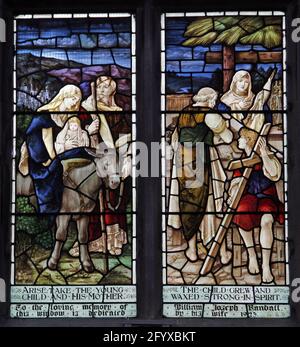 Stained glass window depicting The Flight into Egypt and The Holy Family Lady St Mary  Church, Wareham, Dorset Stock Photo