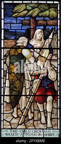 Stained glass window depicting The Holy Family in the carpenter's workshop, Lady St Mary  Church, Wareham, Dorset Stock Photo