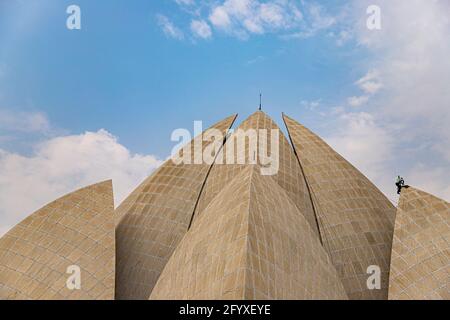 a labor is working at bahai lotus temple,new delhi, india. Stock Photo