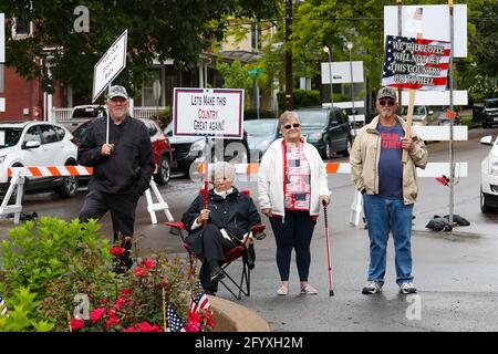 Bloomsburg, United States. 29th May, 2021. Members of We The People of Columbia County hold placards during a rally at Bloomsburg's Market Square.About 100 self-described patriots marched from Bloomsburg Town Park to Market Square for a pro-freedom rally during the Memorial Day weekend. Credit: SOPA Images Limited/Alamy Live News Stock Photo