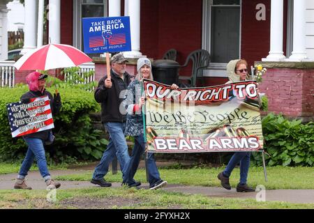 Bloomsburg, United States. 29th May, 2021. Members of We The People of Columbia County march during the rally.About 100 self-described patriots marched from Bloomsburg Town Park to Market Square for a pro-freedom rally during the Memorial Day weekend. Credit: SOPA Images Limited/Alamy Live News Stock Photo