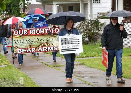 Bloomsburg, United States. 29th May, 2021. Members of We The People of Columbia County march during the rally.About 100 self-described patriots marched from Bloomsburg Town Park to Market Square for a pro-freedom rally during the Memorial Day weekend. Credit: SOPA Images Limited/Alamy Live News Stock Photo