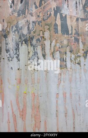 Dirty paper texture with torn posters and paint stains. Abstract background. Stock Photo