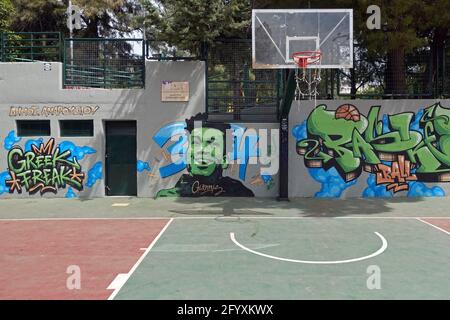 Athens, Greece - April 14, 2021: Giannis Antetokounmpo tribute graffiti in outdoor basketball court wall. Stock Photo