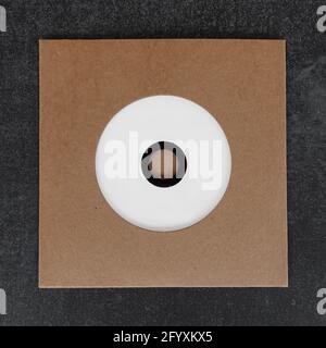Blank white label compact disc cd in die-cut brown cardboard cover. Design element with copy-space for your photo and text. Stock Photo